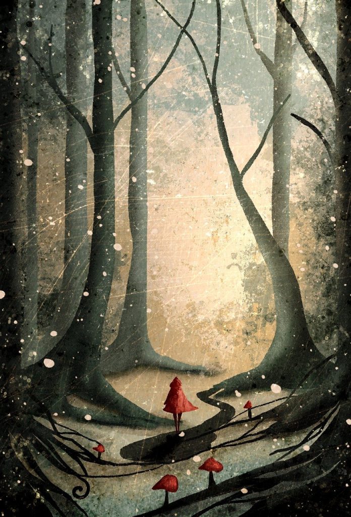 Red riding hood in forest girl walking in a forest trail