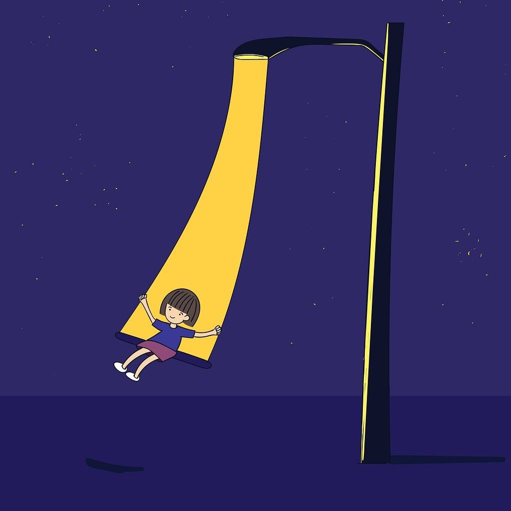 child-wing child swinging from a lamp post in the dark